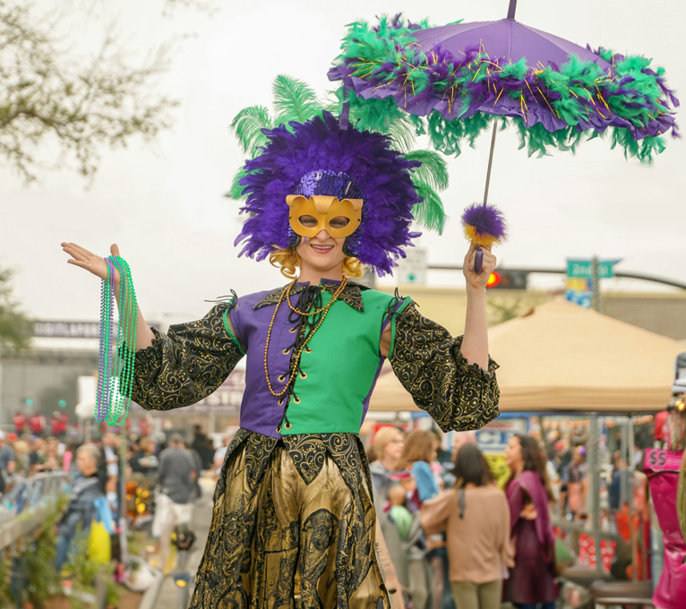 a woman in a costume holding an umbrella at The Oxford